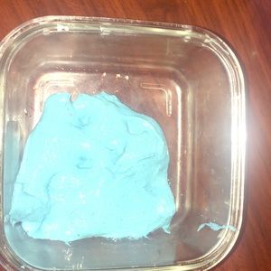 Blue slime that is sticky with glitter in it